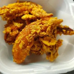 That's the smallest styrofoam container with 5 tiny wings and why is the batter mostly missing