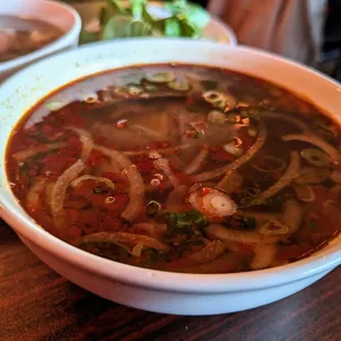 P12. Hue Style Spicy Beef Soup. Medium $12.99. Pho noodles, beef shank, mixed beef, pork, and shrimp broth. Legit very spicy. Watch out.