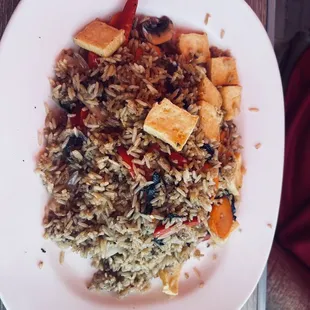 a plate of rice and tofu