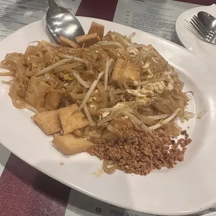 a plate of noodles and tofu