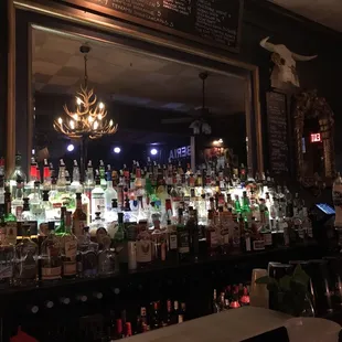 a bar with a lot of liquor bottles