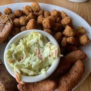 1/4 rack baby back ribs, fried okra, baked sweet potato, pork chop, cole slaw and hush Hushpuppies