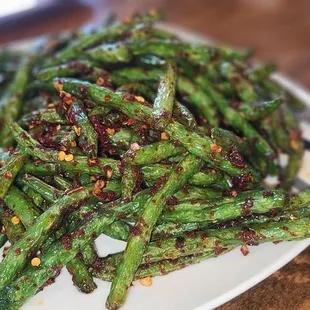 a plate of stir fried green beans