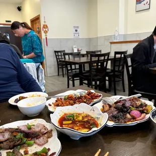 a table full of chinese food