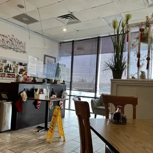 a view of a restaurant with a table and chairs
