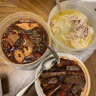 three bowls of food on a table