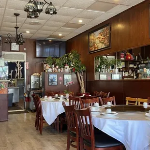 a woman sitting at a table in a restaurant