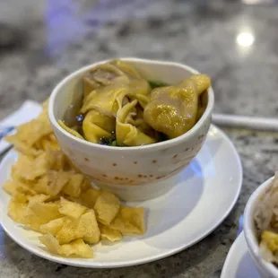 a bowl of soup and a bowl of rice