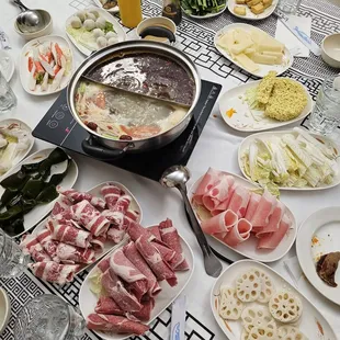 Hot Pot with Rich &amp; Spicy broths, a host of proteins (fish balls, lamb), vegetables (seaweed, bok choi), &amp; starches (lotus root, noodles)