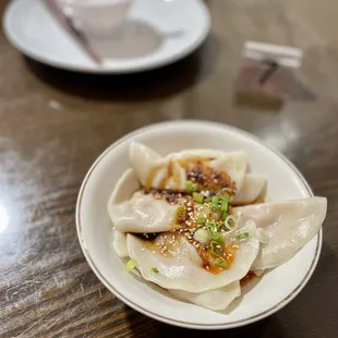 a plate of dumplings on a table