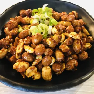 a bowl of stir fried mushrooms