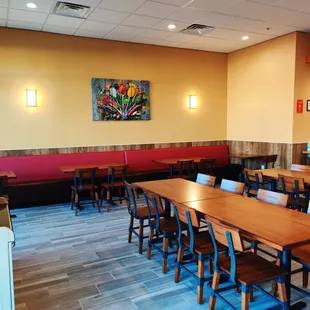 a dining area with tables and chairs