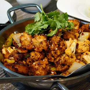 Bullfrog. Crispy and flavorful. Not very spicy... But swampy or gamey at all.