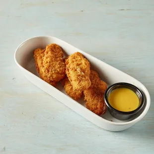 a dish of chicken nuggies