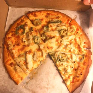 Gluten free buffalo chicken pizza with jalapeños added