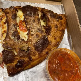 a slice of pizza in a box