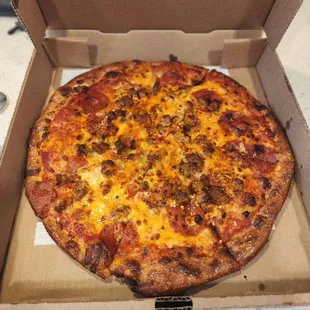 Thin crust cheese, pepperoni,  sausage pizza with spicy sauce