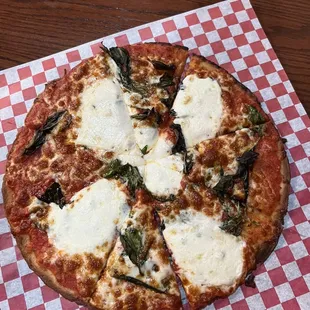 Margherita pizza on small gluten free crust