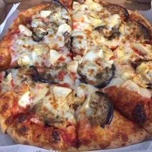 a pizza in a cardboard box