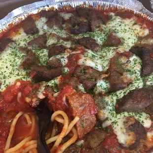 a pizza with meat, cheese, and sauce