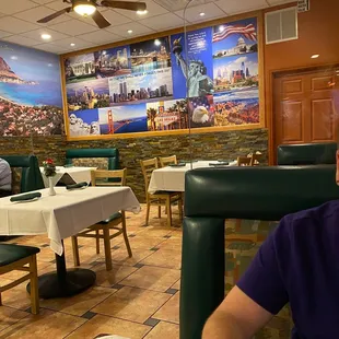 a man sitting at a table in a restaurant