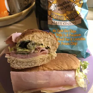 Ham and Swiss with lettuce, pickle, black olives and Mayo. Along with a bag of chips they offer.
