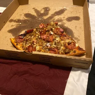 a slice of pizza in a box