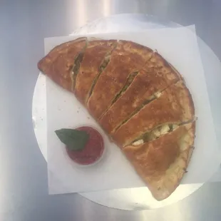 a piece of pizza on a plate