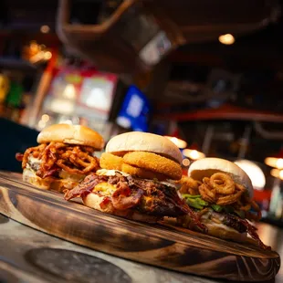 a close up of a burger on a cutting board