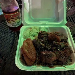 Brown stew chicken, rice and peas, cabbage, festival