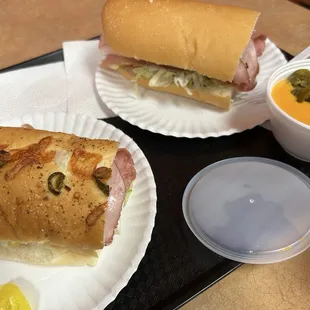 Italian sub on left, Sid's Special on right. Also we got tortilla chips and cheese sauce with jalapeños.