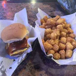 Bronco Burger with an extra patty. (Two 1/4lb patties with American cheese, topped with an onion ring and bbq sauce)