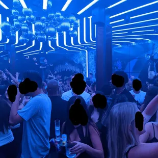 a group of people at a bar