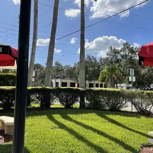 a row of picnic tables and umbrellas