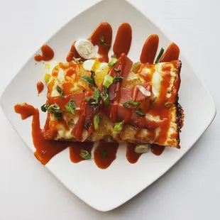 a plate of pizza and sauce