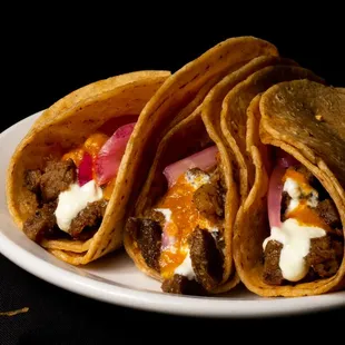 three tacos on a plate