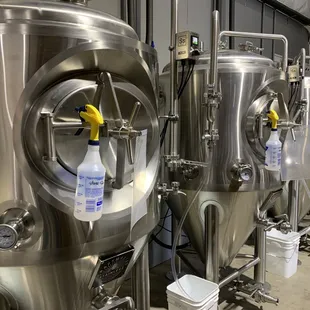 a row of stainless steel tanks