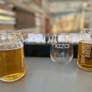 three glasses of beer on a table