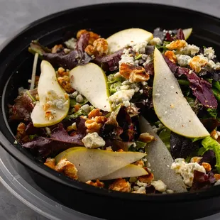 a salad with pears, blue cheese and walnuts