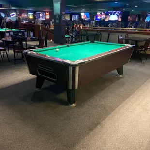 a pool table in a bar