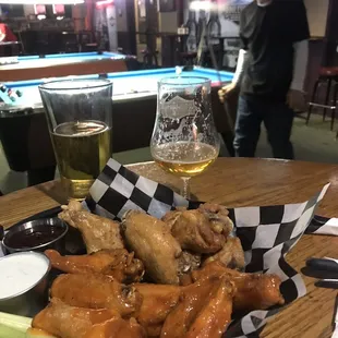 a plate of chicken wings and celery