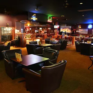 Cozy Lounge Area with Huge Projection Screen TV and Fireplace.