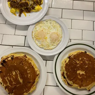 three plates of breakfast food