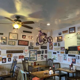 tables, chairs, and a ceiling fan