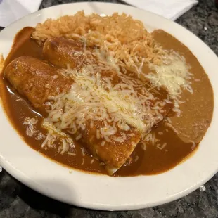Dinner combo: 2 chicken enchiladas, rice, and beans