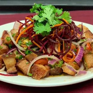 Roast Pork Poke: Chinese Style Crispy Roast Pork Tossed In Our Special Sauce with Onions, Tomatoes &amp; Cilantro.