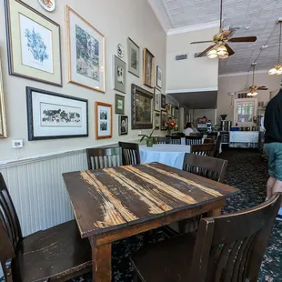 a dining room with a table and chairs