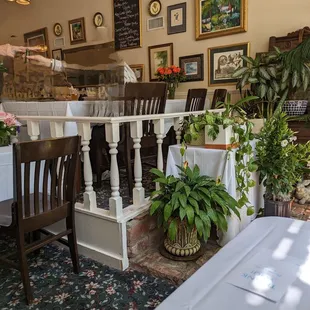 a dining room with tables and chairs