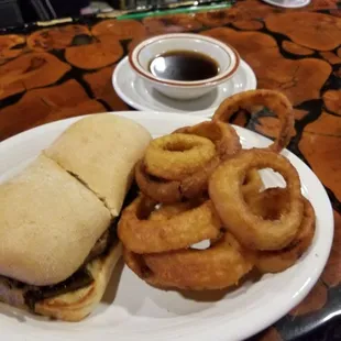 Philly cheese steak with onion rings. Awful.