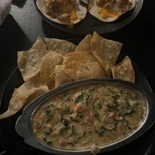 a bowl of soup with tortillas and tortillas